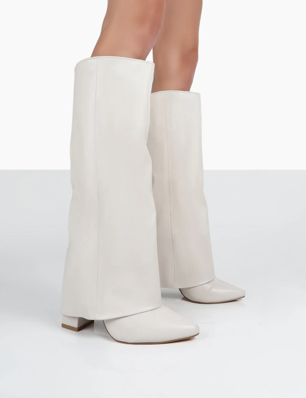 Zendaya Ecru Pointed Toe Knee High Block Boots 1 Zendaya Ecru Pointed Toe Knee High Block Boots