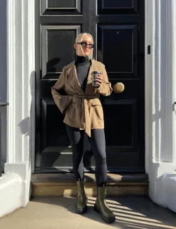 Sheer Knit Roll Neck Top In Black